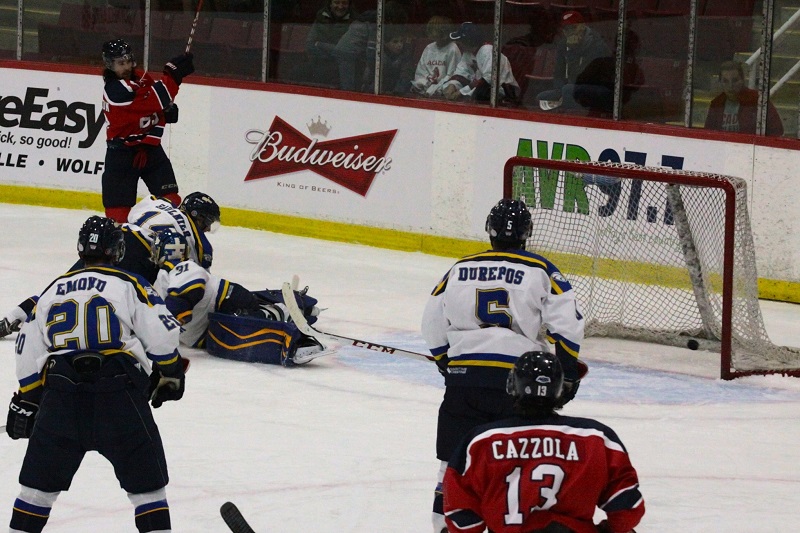 Brett Thompson opens the scoring for the Axemen, as he slides a shot past the sprawling Moncton goalie Lemay.