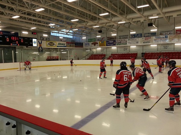 The Acadia Axemen take warmup at Liverpool's  Queens Memorial Arena