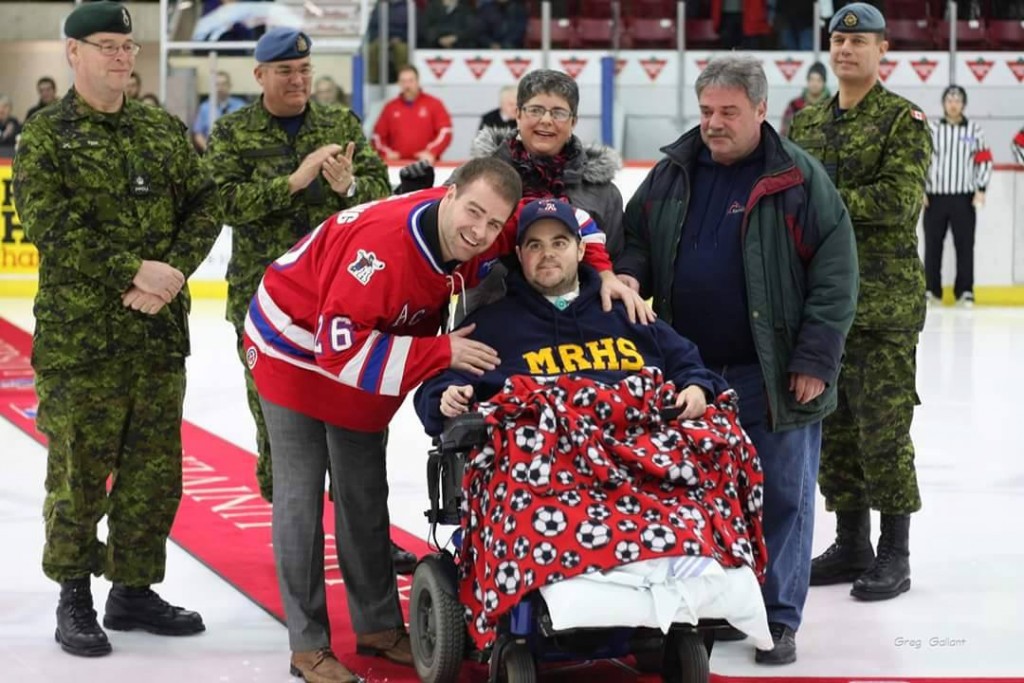 Long-time Acadia Axemen fan Nick Vidito with his former Acadia SMILE buddy & Axemen alumnus Adam Armstrong were on hand for the ceremonial opening faceoff on Canadian Forces night. Nick has been in the hospital for the past few months battling health issues.